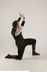 KEETA KNEELING POSE WITH SWORD